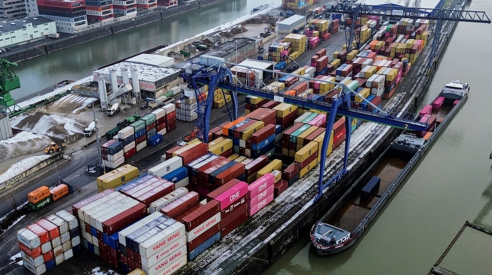 Containers are piled up in Frankfurt, Germany, Friday, Jan. 30, 2026. (AP Photo/Michael Probst)