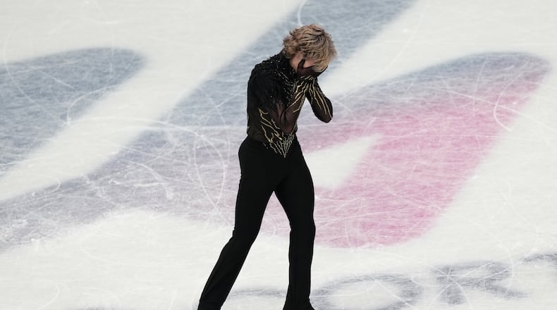 Ilia Malinin of the United States reacts at the end of his program after competing during the men's free skate program in figure skating at the 2026 Winter Olympics, in Milan, Italy, Friday, Feb. 13, 2026. (AP Photo/Francisco Seco)