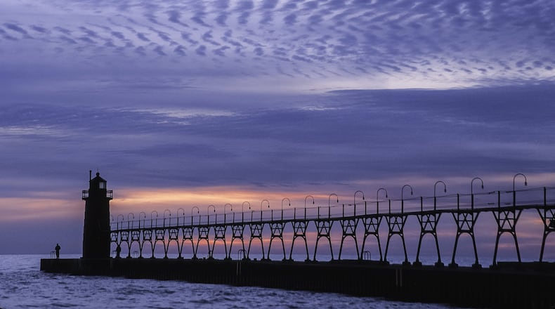 “Sunset at the Pier” taken in Michigan by the late Bro. John Lemker, who has art exhibiting in April at Ed Dixon Gallery. CONTRIBUTED