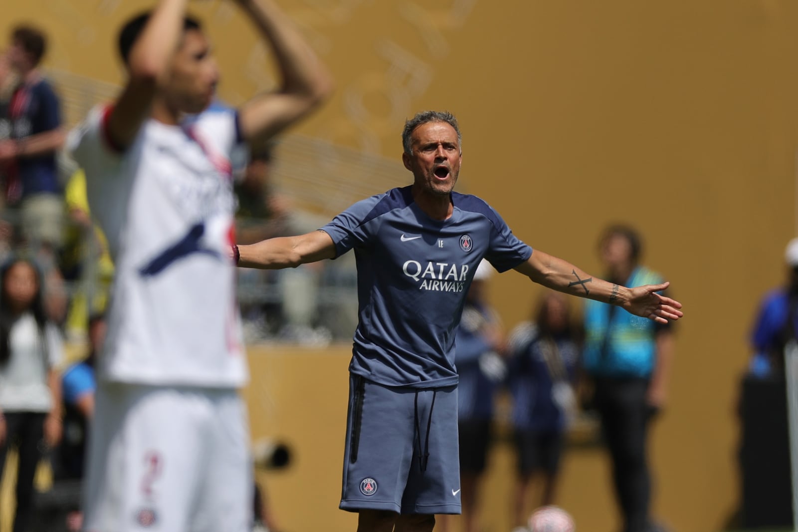Paris Saint-Germain manager Luis Enrique directs his players during the Club World Cup Group B soccer match between Seattle Sounders and PSG in Seattle, Monday, June 23, 2025. (AP Photo/Ryan Sun)