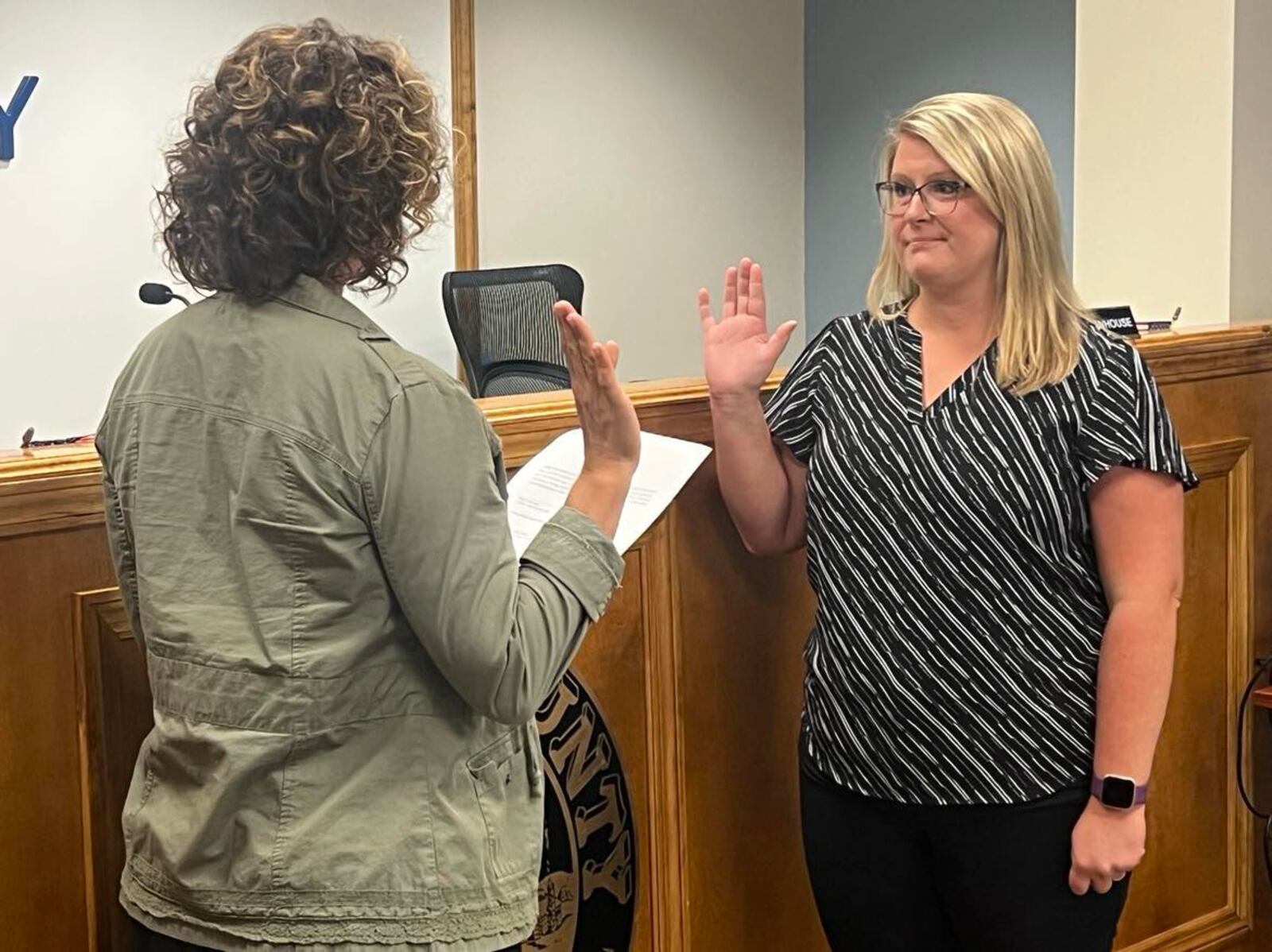 Commissioner Melanie Flax Wilt (left) swears in Hillary Hamilton as acting county auditor on Wednesday, Aug. 30, 2023. CONTRIBUTED
