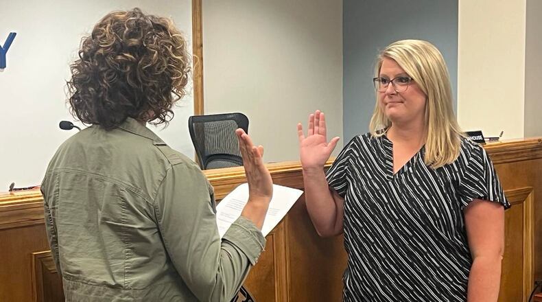 Commissioner Melanie Flax Wilt (left) swears in Hillary Hamilton as acting county auditor on Wednesday, Aug. 30, 2023. CONTRIBUTED