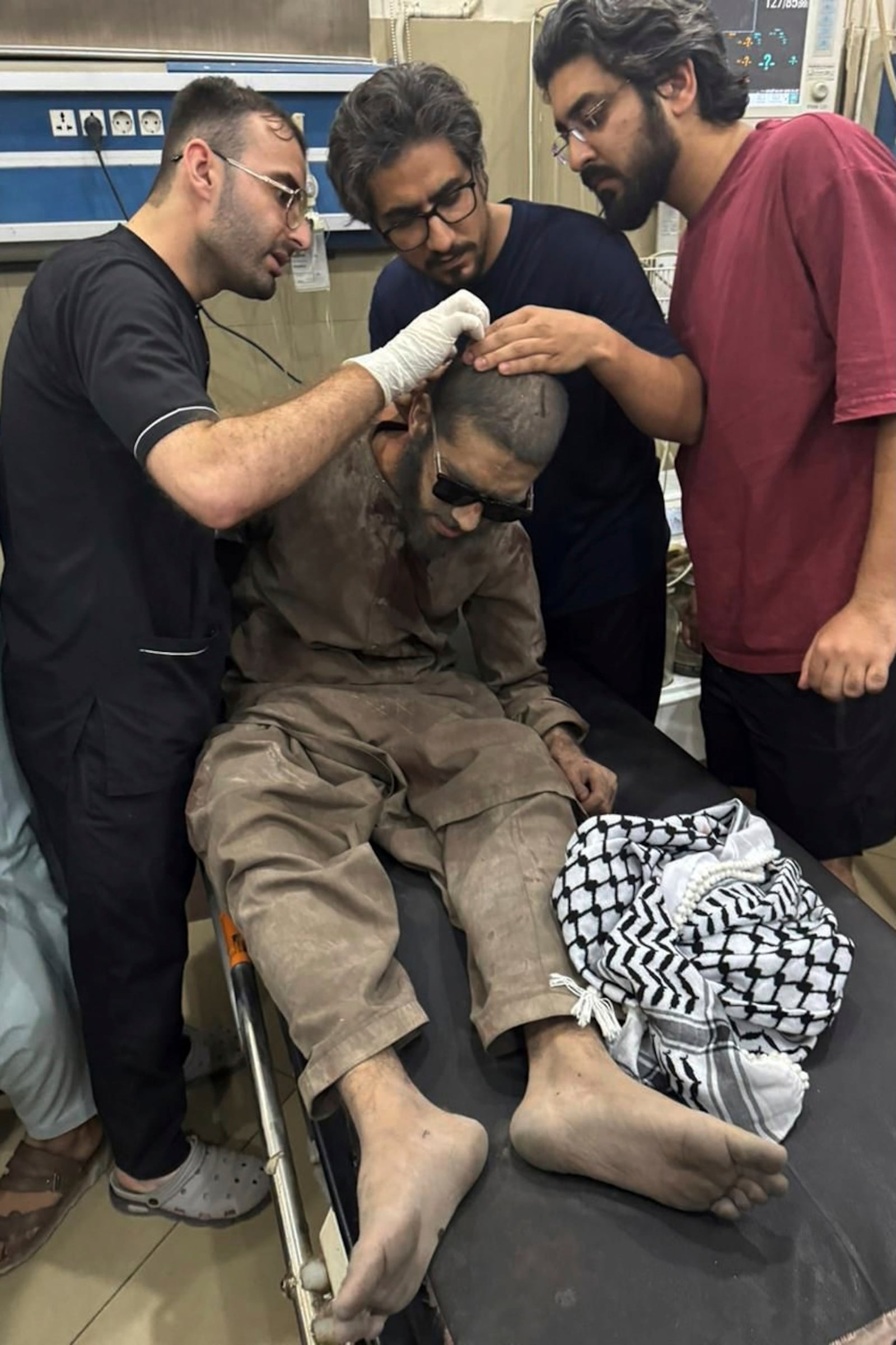 In this photo released by the Inter Services Public Relations, a person injured in a suspected Indian missile attack, receives treatment at a hospital in Bahawalpur, Pakistan, May 7, 2025. (Inter Services Public Relations via AP)