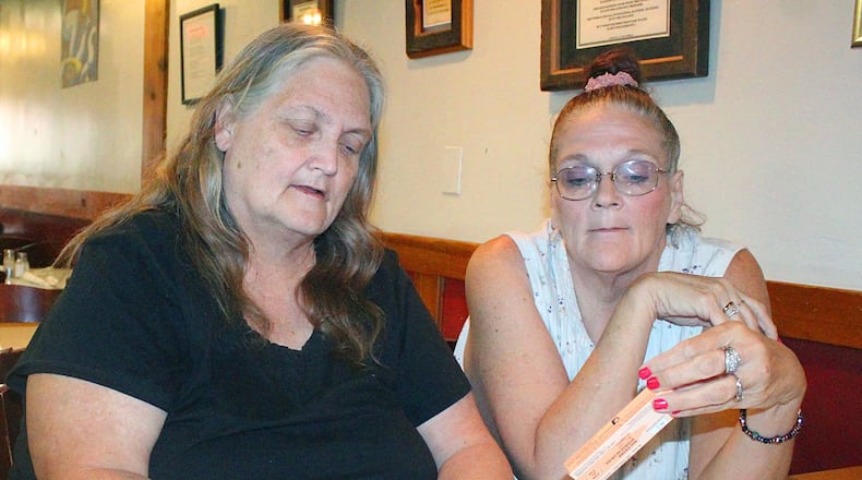 Springfield residents (left) Shelley Case and Sona Storer look over a Narcan kit that was handed out after attending a class on how to administer the nasal spray. JEFF GUERINI/STAFF