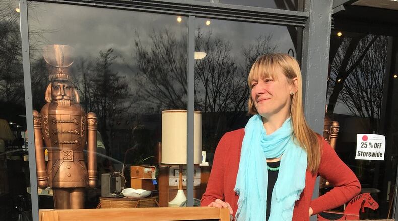 Susan Bell, owner of Rose and Sal Vintage Antique Shop in Yellow Springs, stands outside of her shop on the day after Christmas. Staff photo / Sarah Franks