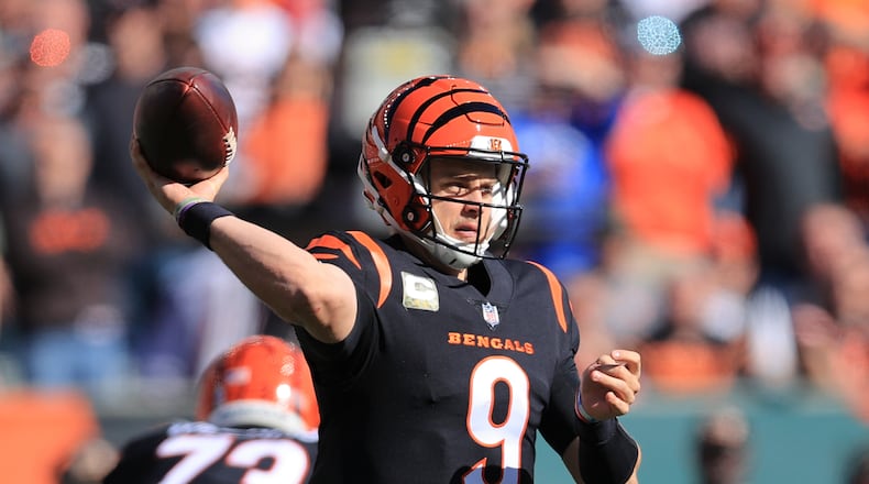 Cincinnati Bengals quarterback Joe Burrow (9) throws during the first half of an NFL football game against the Cleveland Browns, Sunday, Nov. 7, 2021, in Cincinnati. (AP Photo/Aaron Doster)
