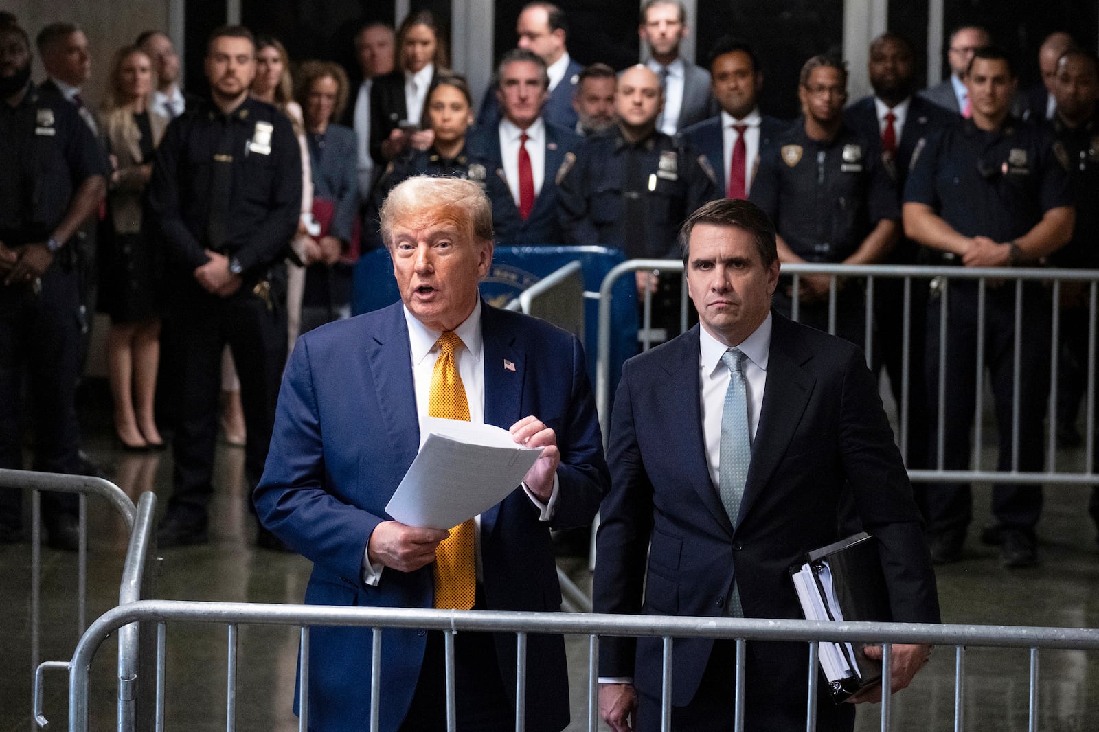 FILE - Former President Donald Trump, left, standing with defense attorney Todd Blanche, speaks at the conclusion of proceedings for the day at his trial at Manhattan criminal court, May 14, 2024, in New York. (AP Photo/Craig Ruttle, Pool, File)