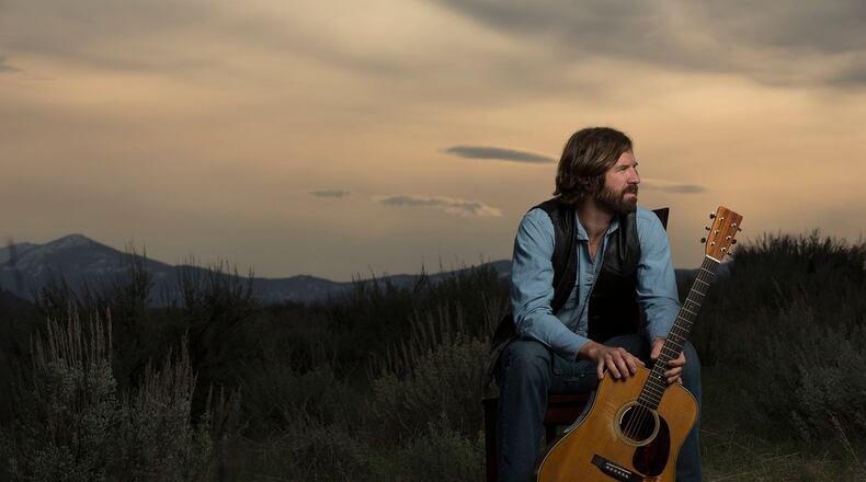 Shawnee High School graduate Michael Shaw has released his first album of outlaw country songs, inspired by his life experiences living in Montana.