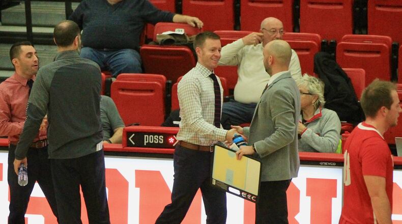 Denison’s Chris Sullivan, center, shakes hands with Wittenberg assistant coach Nathan Wahle after a game in Granville on Jan. 8, 2020. David Jablonski/Staff