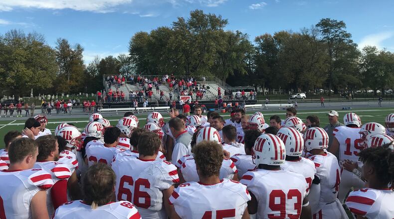 Wittenberg players gather around Joe Fincham after a win at DePauw. Submitted photo