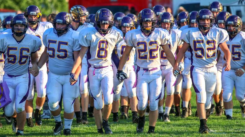 The Mechanicsburg High School football team walks onto the field before its game at Greeneview on Friday, Sept. 14, 2018. The Indians won the game 7-0. Michael Cooper/CONTRIBUTED