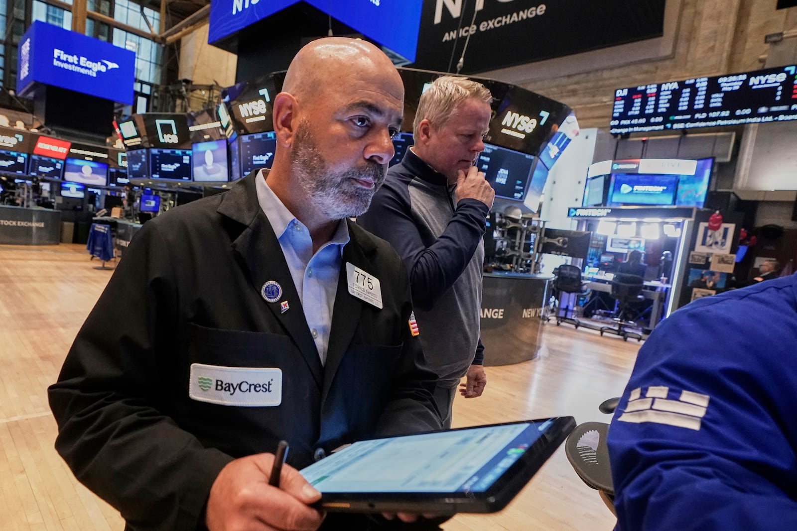 Trader Fred Demarco, left, works on the floor of the New York Stock Exchange, Thursday, May 29, 2025. (AP Photo/Richard Drew)