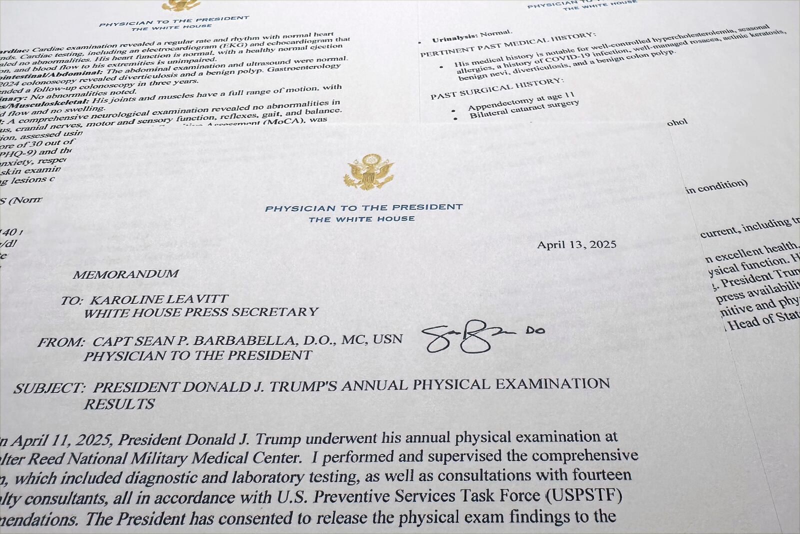 The report on President Donald Trump's health after his physical on April 11, 2025, at Walter Reed National Military Medical Center, released by the White House on behalf of his physician Navy Capt. Sean Barbabella, is photographed Sunday, April 13, 2025. (AP Photo/Jon Elswick)