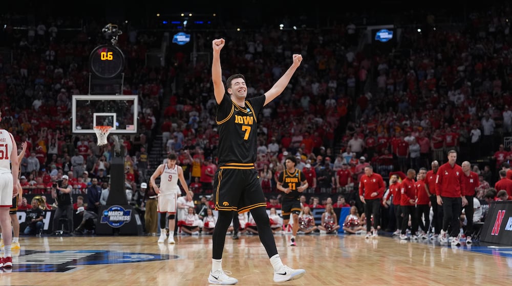 Iowa forward Alvaro Folgueiras (7)celebrates after defeating Nebraska in the Sweet 16 of the NCAA college basketball tournament Thursday, March 26, 2026, in Houston. (AP Photo/Eric Gay)
