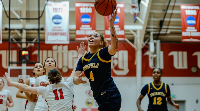 Springfield High School senior Daryn Hitchcock drives to the hoop during their game against Tecumseh on Tuesday night at Wittenberg University's Pam Evans Smith Arena. MICHAEL COOPER / STAFF