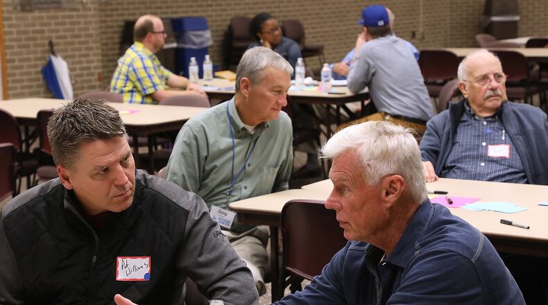 Citizens and members of the media share their thoughts about Springfield with each other during the Your Voice Ohio community meeting at Clark State Monday. BILL LACKEY/STAFF