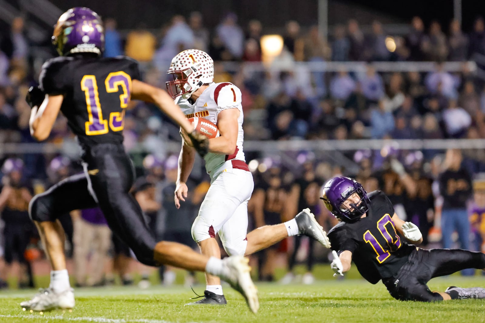 Northeastern High School senior Cody Houseman runs past Mechanicsburg senior Connor Shultz during their game Friday, Oct. 17 at Indian Stadium. Houseman scored on the play and the Jets won 52-36. MICHAEL COOPER / STAFF
