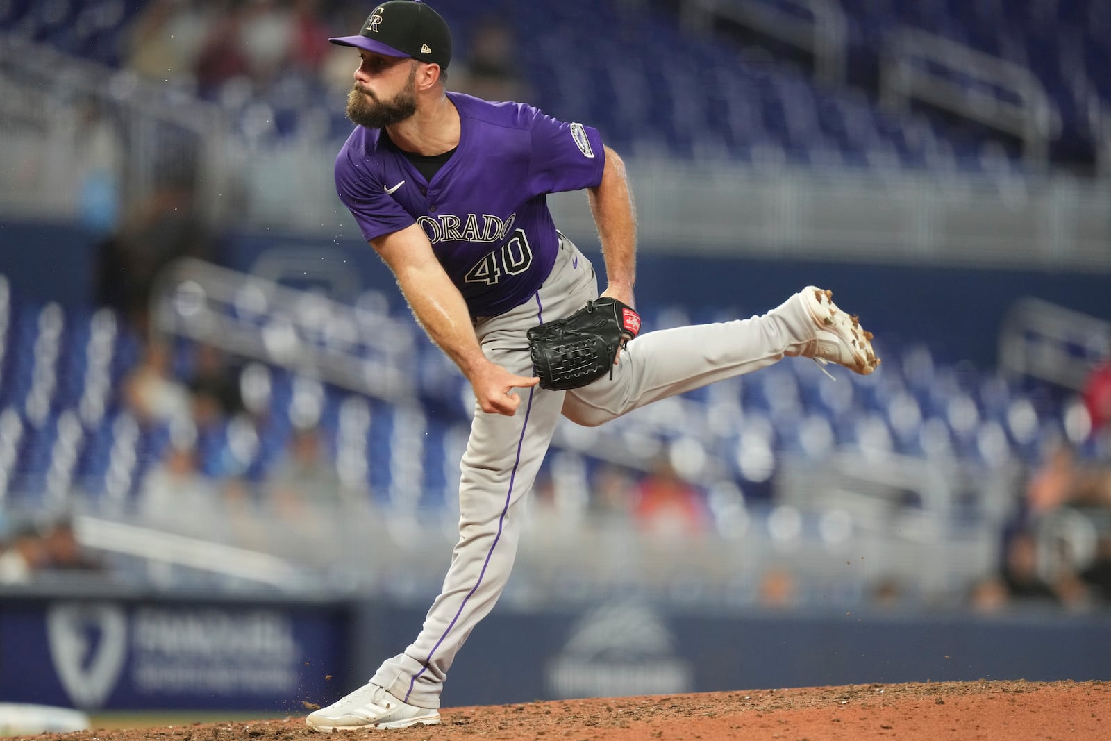 Colorado Rockies relief pitcher Tyler Kinley follows through on a pitch during the ninth inning of a baseball game against the Miami Marlins, Wednesday, June 4, 2025, in Miami. (AP Photo/Lynne Sladky)