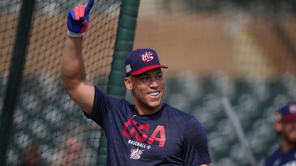 United States' Aaron Judge smiles while taking batting practice prior to an exhibition baseball game against the Colorado Rockies Wednesday, March 4, 2026, in Scottsdale, Ariz. (AP Photo/Ross D. Franklin)