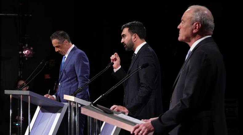 Independent candidate former New York Gov. Andrew Cuomo, Republican candidate Curtis Sliwa and Democratic candidate Assemblyman Zohran Mamdani participate in a second New York City mayoral debate at LaGuardia Performing Arts Center at LaGuardia Community College in the Queens borough of New York, Wednesday, Oct. 22, 2025. (Hiroko Masuike/The New York Times via AP, Pool)