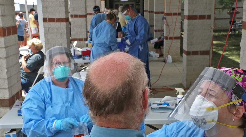 The Clark County Combined Health District held free COVID-19 testing clinics last year, with once clinic site Perrin Woods Elementary. With the rise in local cases, the county's health district may ramp up its testing efforts. BILL LACKEY/STAFF