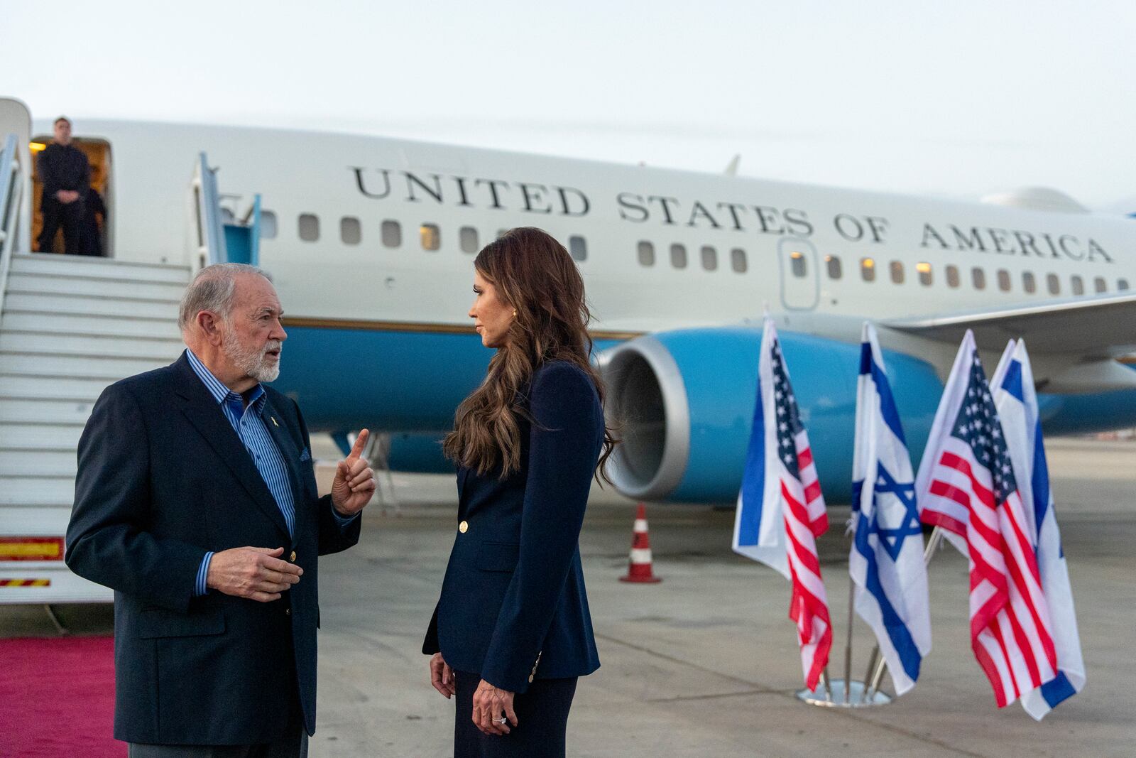 Homeland Security Secretary Kristi Noem speaks with Ambassador Mike Huckabee arrives at Ben Gurion Airport, Sunday, May 25, 2025, Tel Aviv, Israel. (AP Photo/Alex Brandon, Pool)