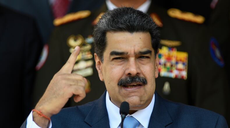 FILE - In this March 12, 2020, file photo, Venezuelan President Nicolas Maduro gives a press conference at the Miraflores presidential palace in Caracas, Venezuela. (AP Photo/Matias Delacroix, File)