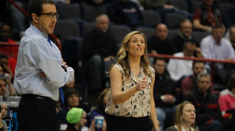 Dayton women's basketball assistant coach Camryn Whitaker, right, and head coach Jim Jabir watch the action during the 2015 NCAA tournament in Albany, N.Y. David Jablonski/Staff