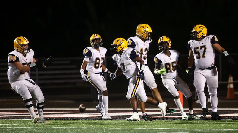 Springfield celebrates a touchdown run by Jayvin Norman in the third quarter against Wayne on Friday, Sept. 8, 2023, in Huber Heights. David Jablonski/Staff