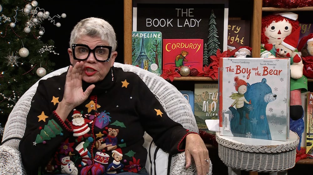 The Book Lady, Pam McGinnis, lets children in on a secret. CONTRIBUTED