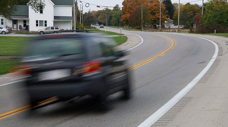 The site of the fatal bus crash on Ohio Route 41 in German Township Thursday, Oct. 19, 2023. After a deadly school bus crash on Aug. 22 in which a minivan crossed the center line, parents and a local official asked the Ohio Department of Transportation to add rumble stripes to the center in the area, like those shown on the side of Ohio 41 here. ODOT said the road qualifies for the center line stripes, which will be added soon. BILL LACKEY/STAFF