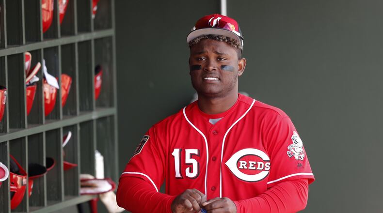 Cincinnati Reds’ Dilson Herrera walks in the dugout before a spring training baseball game against the Kansas City Royals, Wednesday, Feb. 28, 2018, in Surprise, Ariz. (AP Photo/Charlie Neibergall)