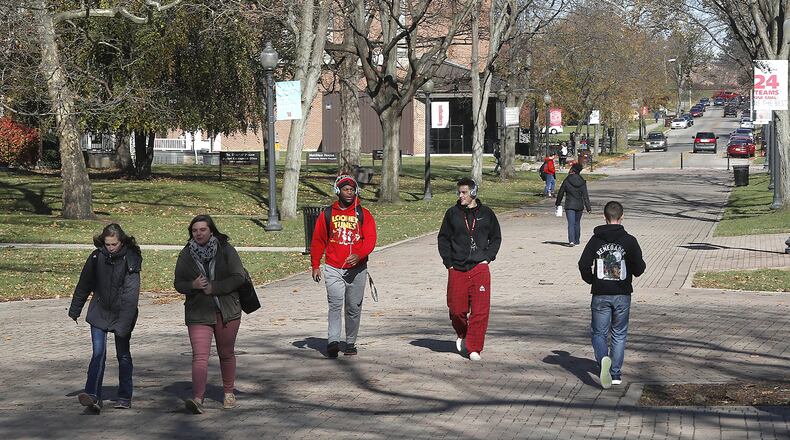 Wittenberg University students walk across campus Monday. According to University President Mike Frandsen, the key to Wittenberg’s future in boosting enrollment. Bill Lackey/Staff