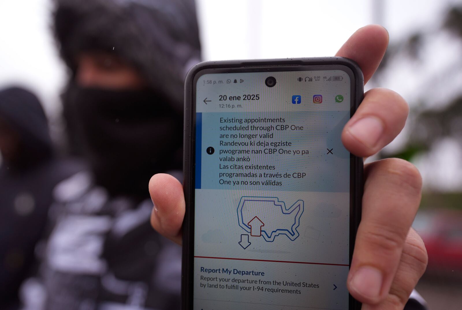 FILE - A migrant seeking asylum holds up the CBP One app showing his appointment was canceled after President Donald Trump was sworn into office, Monday, Jan. 20, 2025, in Matamoros, Mexico. (AP Photo/Eric Gay,File)