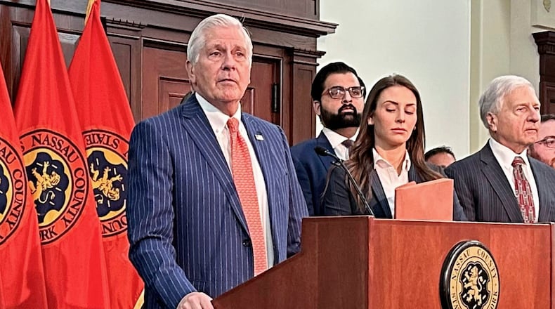 FILE - Nassau County Executive Bruce Blakeman, at podium, speaks during a news conference in Mineola, N.Y., March 6, 2024. (AP Photo/Philip Marcelo, File)