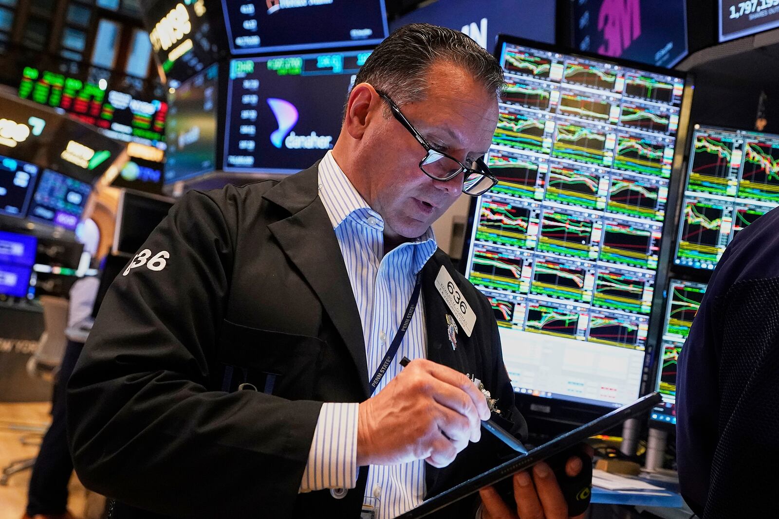 Trader Edward Curran works on the floor of the New York Stock Exchange, Wednesday, May 14, 2025. (AP Photo/Richard Drew)