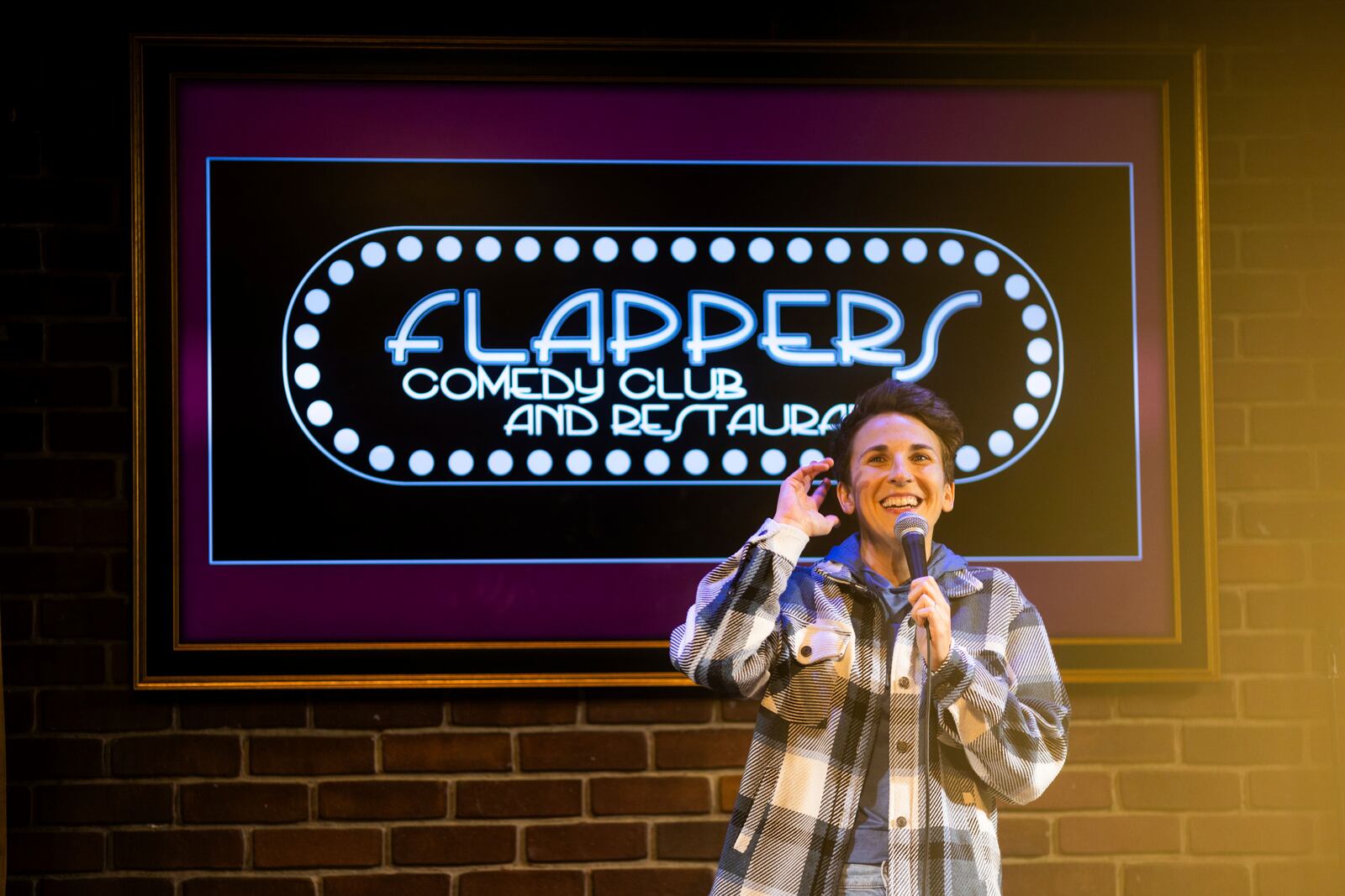 Kaycee Conlee performs during Stand Up For Climate, a comedy show at Flappers Comedy on Thursday, March 20, 2025, in Burbank, Calif. (AP Photo/Ethan Swope)