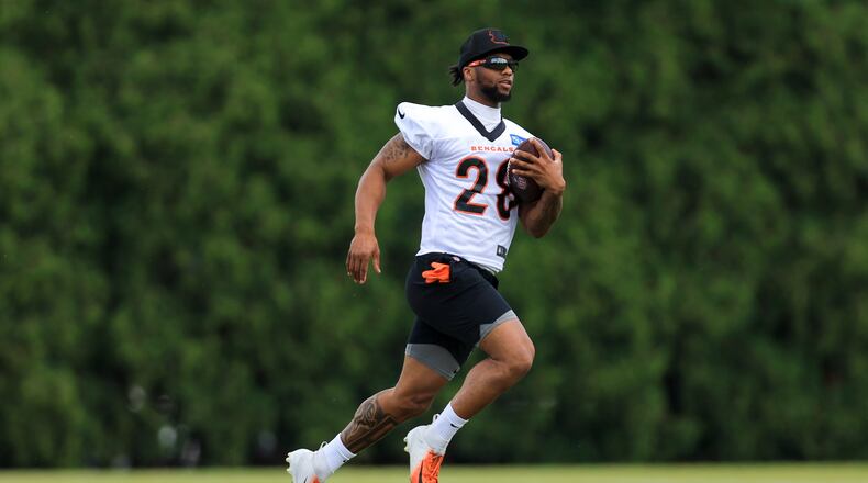 Cincinnati Bengals' Joe Mixon carries the ball during a practice at the NFL football team's training field in Cincinnati, Tuesday, May 30, 2023. (AP Photo/Aaron Doster)
