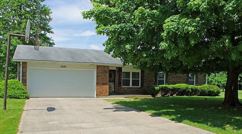 This brick-and-vinyl ranch home sits on a .75-acre lot and has about 1,180 sq. ft. of living space with 3 bedrooms and an open floor plan. CONTRIBUTED PHOTO BY VICKIE KAPNAS