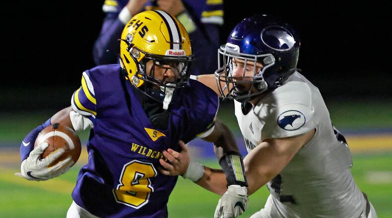 Springfield's Sherrod Lay is tackled by Fairmont's Gavin Proffitt during last week's game.  BILL LACKEY/STAFF