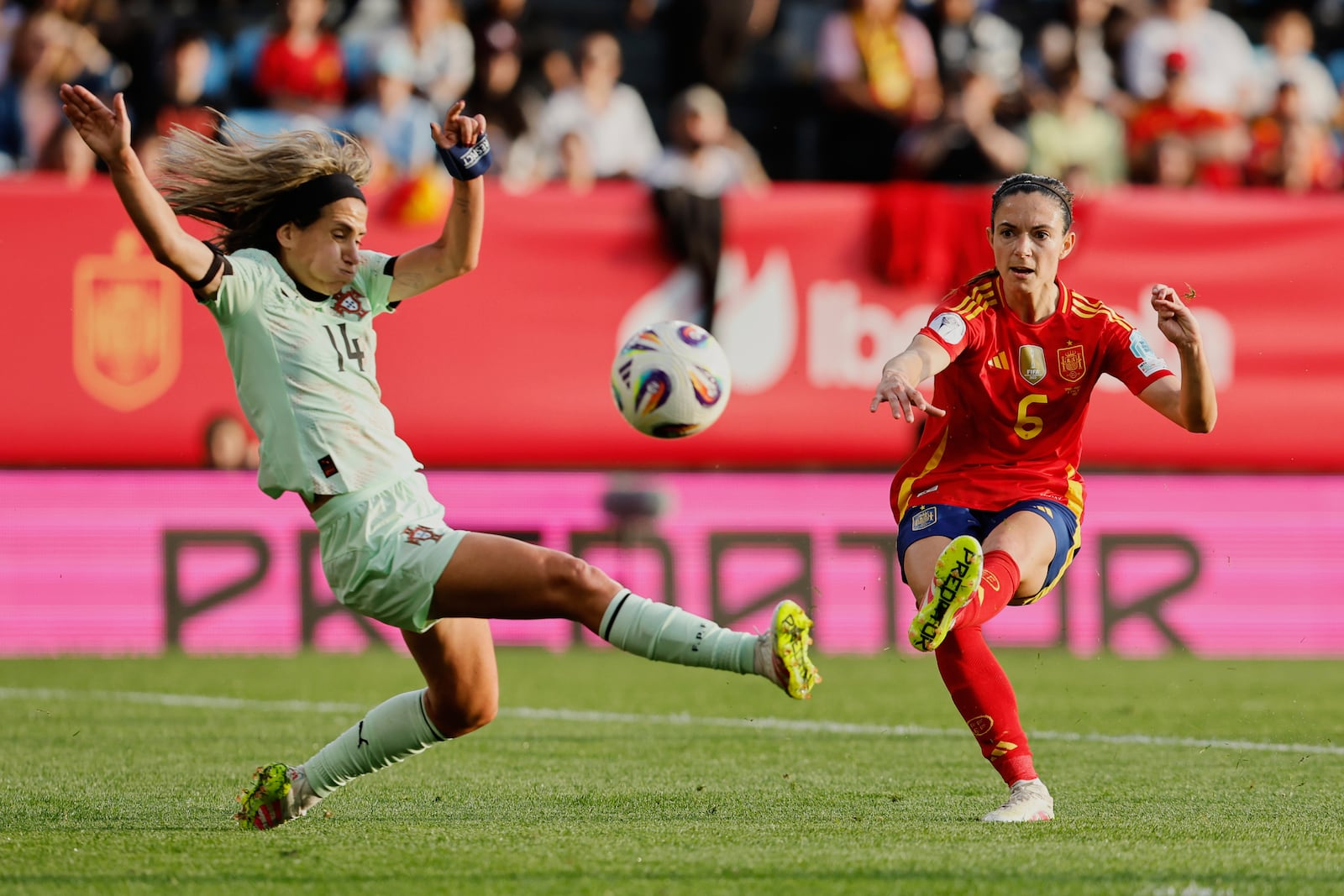 FILE - Spain's Aitana Bonmati, right, plays the ball past Portugal's Dolores Silvia during the Women's Nations League Group A3 soccer match between Spain and Portugal at the Balaidos stadium in Vigo, Spain, Tuesday, April 8, 2025. (AP Photo/Lalo Villar, File)