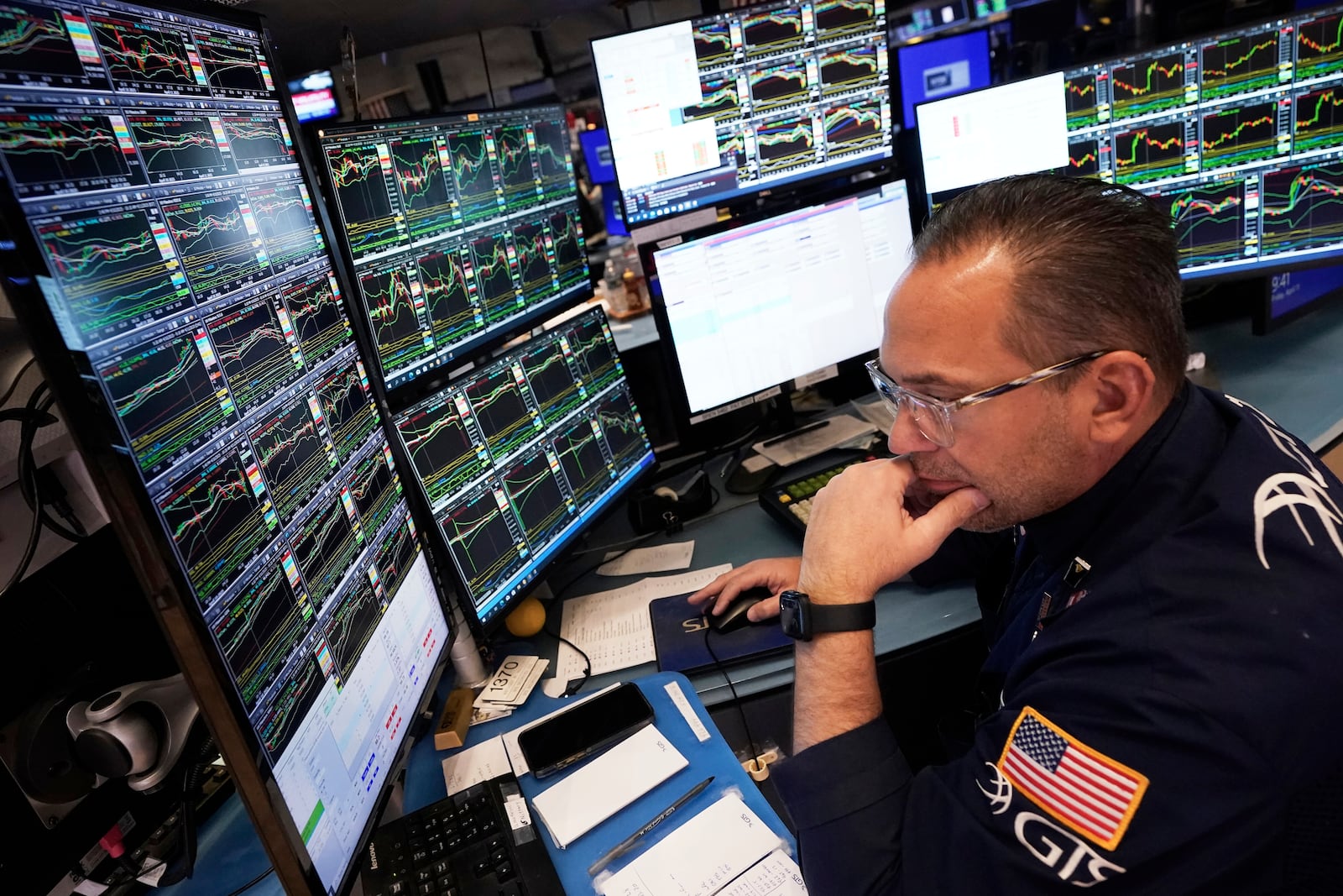 Specialist Anthony Matesic works at his post on the floor of the New York Stock Exchange, Friday, April 11, 2025. (AP Photo/Richard Drew)