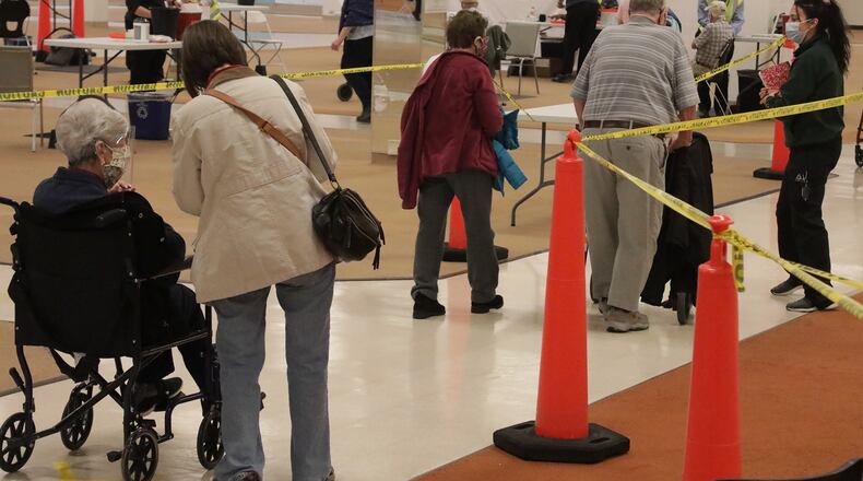 Clark County seniors over 80 years of age wait in line to get the COVID vaccine earlier this month. BILL LACKEY/STAFF