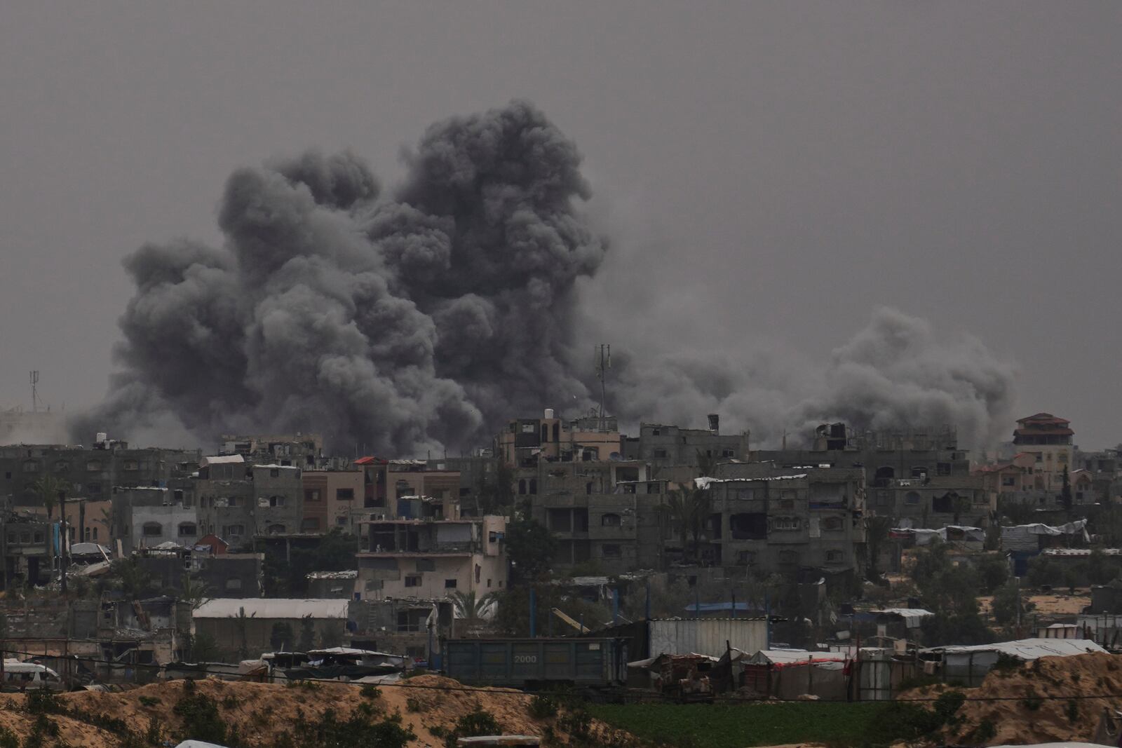 Smoke rises to the sky following an Israeli bombardment in Khan Younis, Gaza Strip, Thursday, April 24, 2025. (AP Photo/Abdel Kareem Hana)