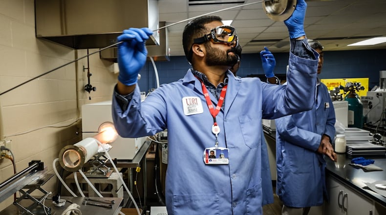 University of Dayton chemical engineering grad student, Muhammad Qasim Ali prepares the PFAS incinerator at the research Insititute. Students and faculty are working on way to eliminate PFAS from the environment. JIM NOELKER/STAFF