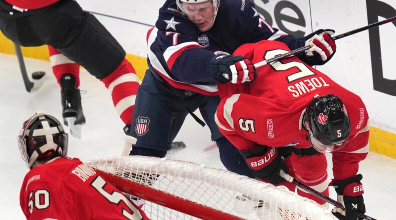 FILE - United States' Brady Tkachuk checks Canada's Devon Toews (5) during the first period of the 4 Nations Face-Off championship hockey game, Feb. 20, 2025, in Boston. (AP Photo/Charles Krupa, File)