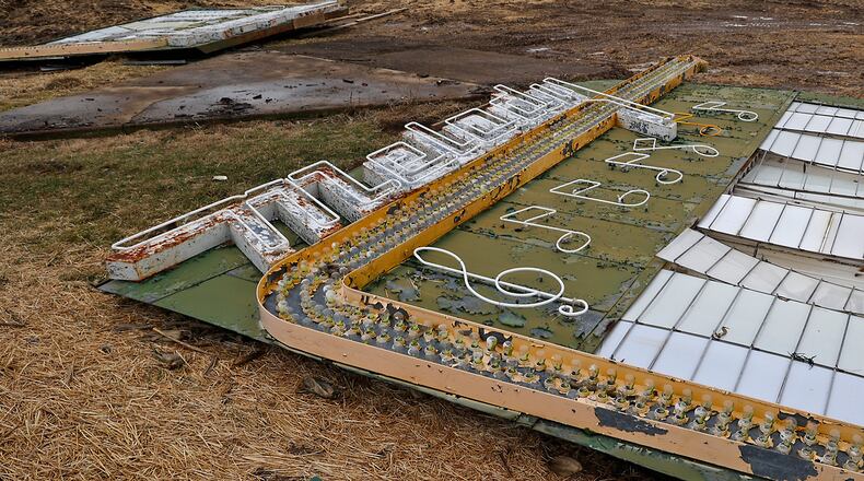 The sign in front of the Melody drive-in was the last thing to come down. The sign, which stood along U.S. 40 for decades, was disassembled and waiting to be moved and preserved Thursday, Feb. 16, 2023. BILL LACKEY/STAFF
