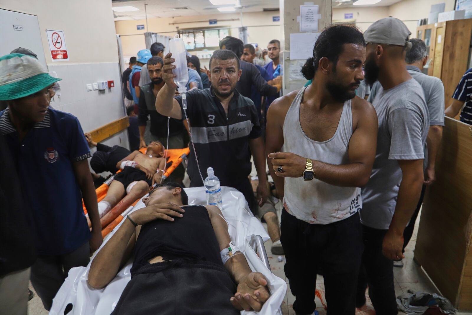 Palestinians wounded while returning from one of the Gaza Humanitarian Foundation distribution centers operated by the U.S.-backed organization, according to Nasser Hospital, are treated in Khan Younis, Monday, June 30, 2025. (AP Photo/Mariam Dagga)