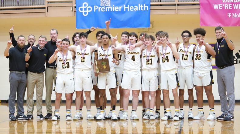 The Shawnee High School boys basketball team celebrates after winning its first district title since 1977. Michael Cooper/CONTRIBUTED