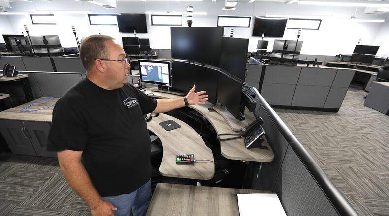 Major Chris Clark, of the Clark County Sheriff’s Department, talks about the new dispatch center. BILL LACKEY/STAFF